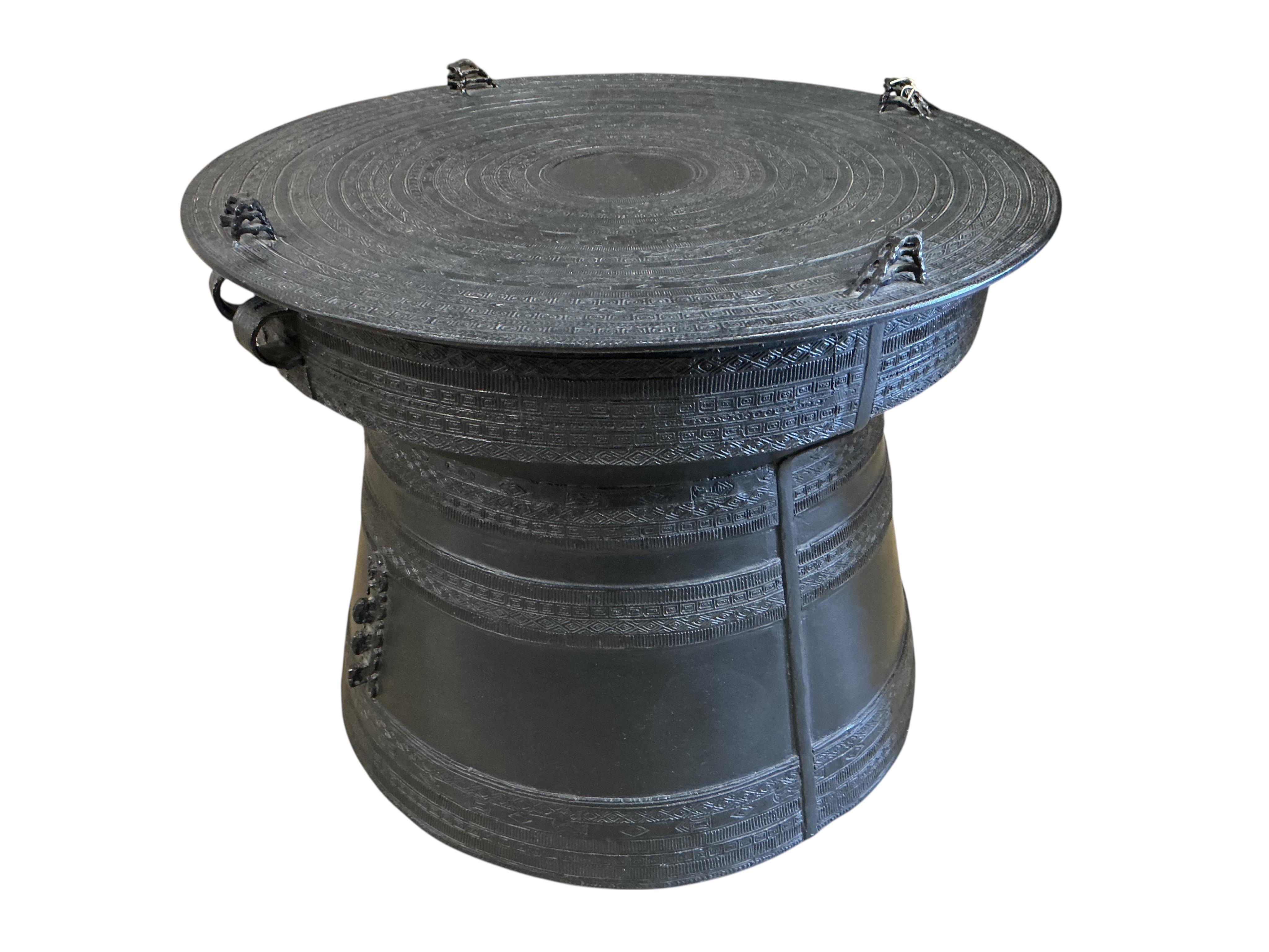 A South East Asian cast metal rain drum table, diameter 62cm, height 48cm